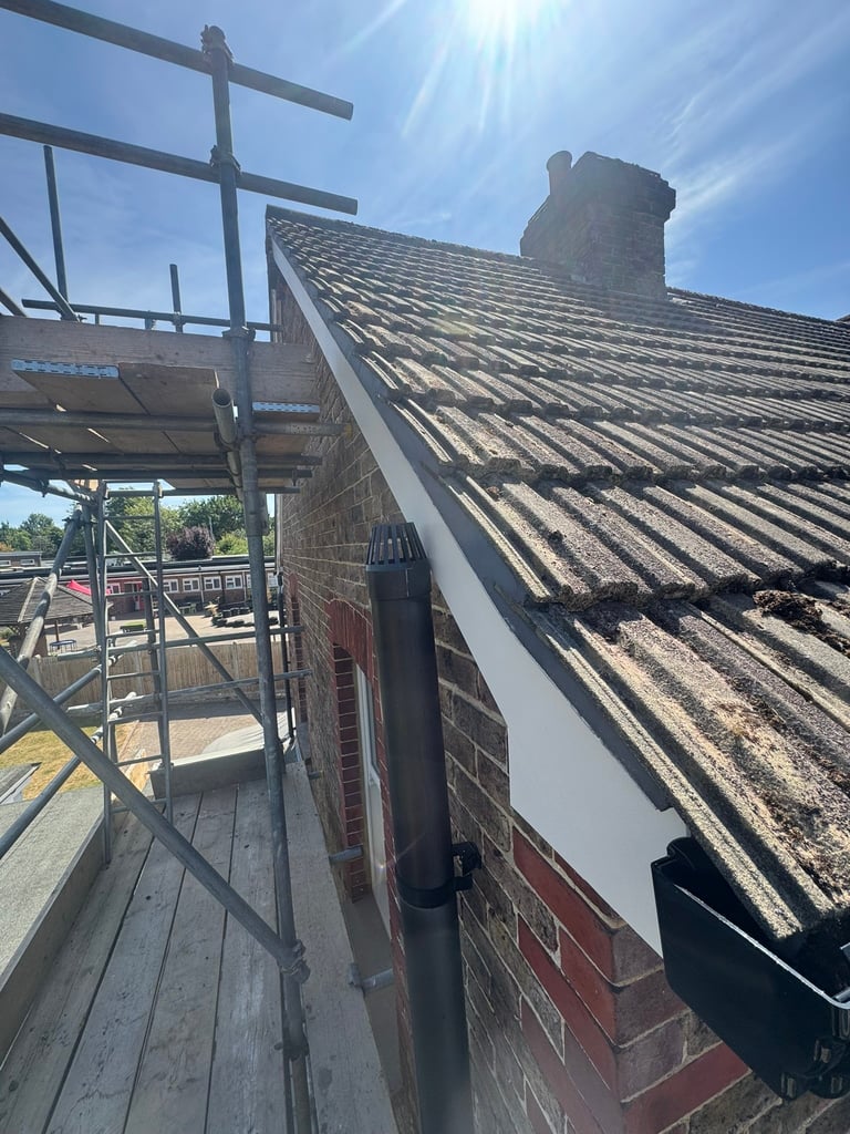 Completed gable verge repair with new Fibre Cement Undercloak and Remix roof tile bedding mortar in Burgess Hill.